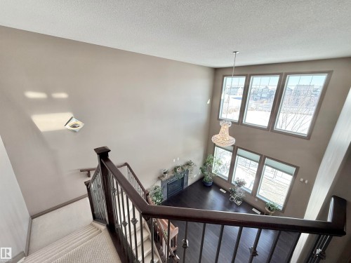 Stairs with a high textured ceiling - 1019 174 Street, Edmonton, AB - Indoor Photo Showing Other Room