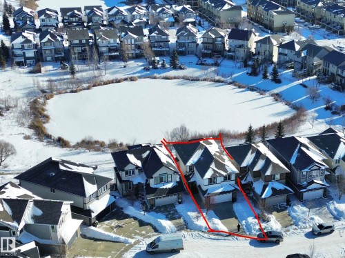 Snowy aerial view featuring a residential view and property boundaries highlighted - 1019 174 Street, Edmonton, AB - Outdoor With Facade