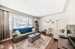 Living area with dark wood finished floors and baseboards - 
