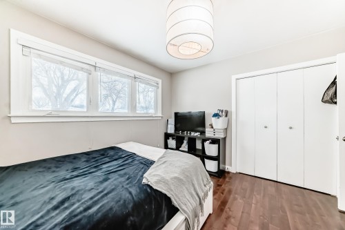 Bedroom featuring dark wood-style floors and a closet - 12332 129 Street, Edmonton, AB - Indoor Photo Showing Bedroom