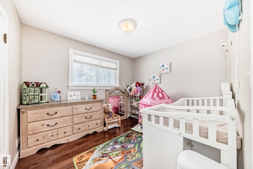 Bedroom with dark wood-style floors - 12332 129 Street, Edmonton, AB - Indoor Photo Showing Bedroom