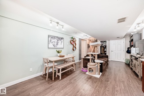 Dining area with stairs and light wood-style floors - 12332 129 Street, Edmonton, AB - Indoor