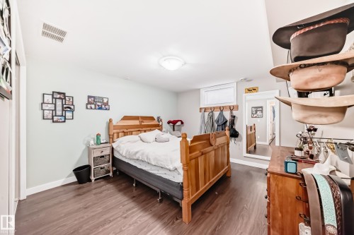 Bedroom featuring wood finished floors and baseboards - 12332 129 Street, Edmonton, AB - Indoor Photo Showing Bedroom