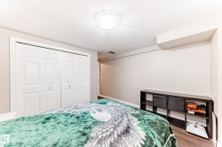 Bedroom with a closet and wood finished floors - 