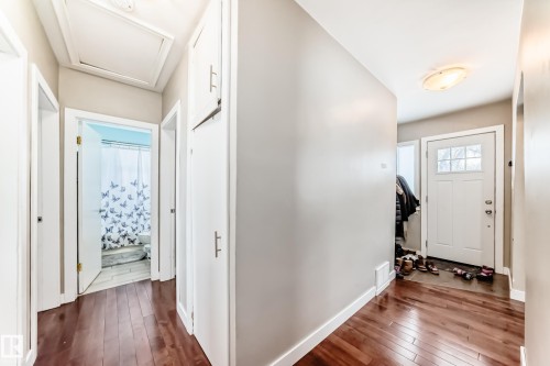 Foyer featuring dark wood finished floors and baseboards - 12332 129 Street, Edmonton, AB - Indoor Photo Showing Other Room