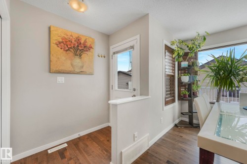 Hall with dark wood finished floors and a textured ceiling - 281 Southwick Way, Leduc, AB - Indoor Photo Showing Other Room
