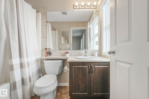 Bathroom featuring vanity and shower / bath combo - 281 Southwick Way, Leduc, AB - Indoor Photo Showing Bathroom