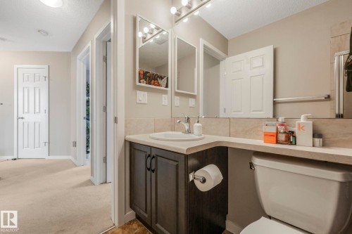 Full bath with vanity, a textured ceiling, and carpet floors - 281 Southwick Way, Leduc, AB - Indoor Photo Showing Bathroom