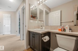Full bath with vanity, a textured ceiling, and carpet floors - 