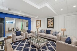 Living area with recessed lighting and wood finished floors - 