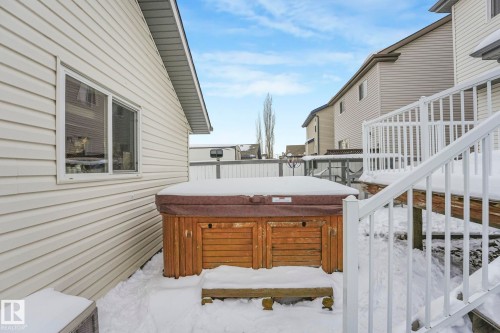 Snow covered deck with a hot tub - 281 Southwick Way, Leduc, AB - Outdoor With Deck Patio Veranda With Exterior