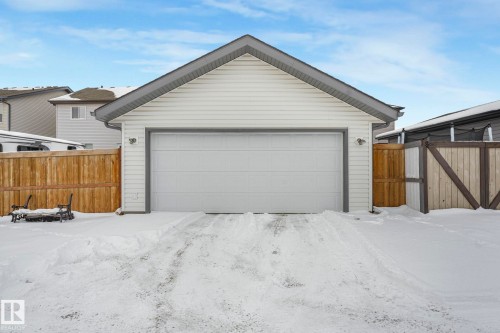 Snow covered garage with a detached garage - 281 Southwick Way, Leduc, AB - Outdoor With Exterior