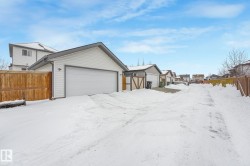 View of front of house featuring a residential view and an outdoor structure - 