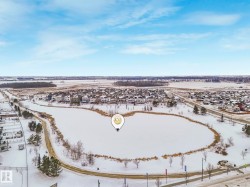 Snowy aerial view featuring a residential view - 
