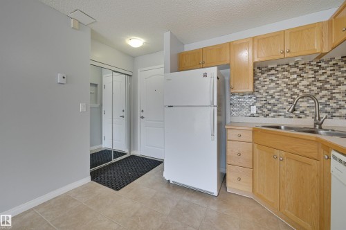 104 9525 162 Avenue, Edmonton, AB - Indoor Photo Showing Kitchen With Double Sink