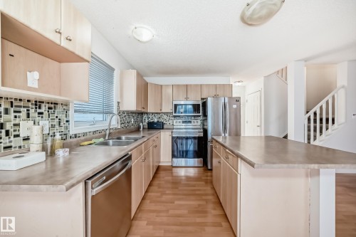 42 2021 Grantham Crest, Edmonton, AB - Indoor Photo Showing Kitchen With Stainless Steel Kitchen With Double Sink