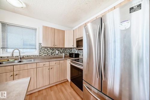 42 2021 Grantham Crest, Edmonton, AB - Indoor Photo Showing Kitchen With Stainless Steel Kitchen With Double Sink