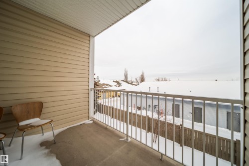 View of snow covered back of property - 211 4310 33 Street, Stony Plain, AB - Outdoor With Balcony With Exterior