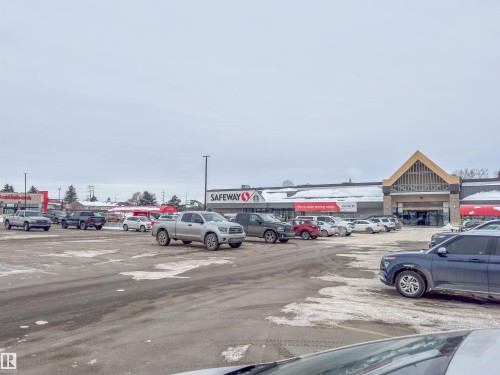 View of uncovered parking lot - 211 4310 33 Street, Stony Plain, AB - Outdoor With View