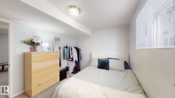 Bedroom featuring carpet floors and a textured ceiling - 