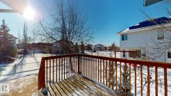 Snow covered deck featuring a residential view - 