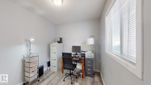 Office space featuring light wood-style floors and a textured ceiling - 17010 84 Street, Edmonton, AB - Indoor Photo Showing Office