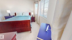 Bedroom with light colored carpet - 