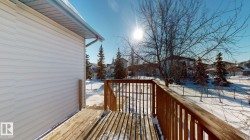 Snow covered deck with a residential view - 