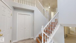 Stairs featuring baseboards and wood finished floors - 