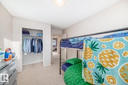 Bedroom with carpet flooring and a closet - 