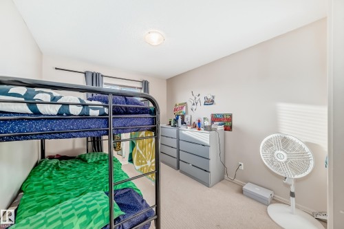 Carpeted bedroom with baseboards - 1285 Cunningham Drive, Edmonton, AB - Indoor Photo Showing Bedroom