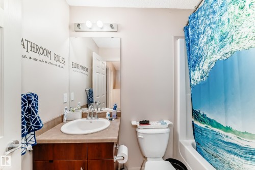 Bathroom with shower / bath combo with shower curtain and vanity - 1285 Cunningham Drive, Edmonton, AB - Indoor Photo Showing Bathroom
