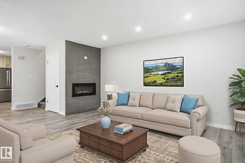 4035 38 Street, Edmonton, AB - Indoor Photo Showing Living Room With Fireplace