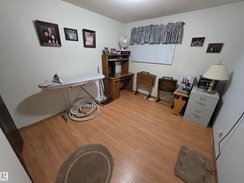 Office featuring a textured ceiling and light wood finished floors - 4400 45 Avenue, Stony Plain, AB - Indoor Photo Showing Other Room
