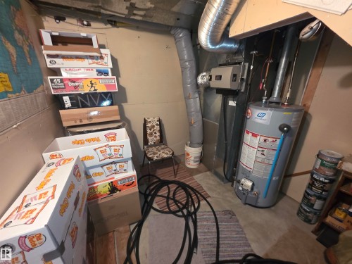 Utility room with gas water heater - 4400 45 Avenue, Stony Plain, AB - Indoor Photo Showing Basement