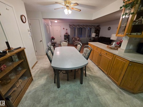 Dining space with ceiling fan and a textured ceiling - 4400 45 Avenue, Stony Plain, AB - Indoor Photo Showing Dining Room