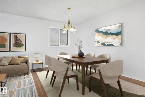 Dining space with wood finished floors, hanging lights, and a textured ceiling - 17816 94 Street, Edmonton, AB - Indoor Photo Showing Dining Room