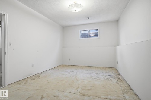 Unfurnished room featuring unfinished concrete floors - 17816 94 Street, Edmonton, AB - Indoor Photo Showing Other Room