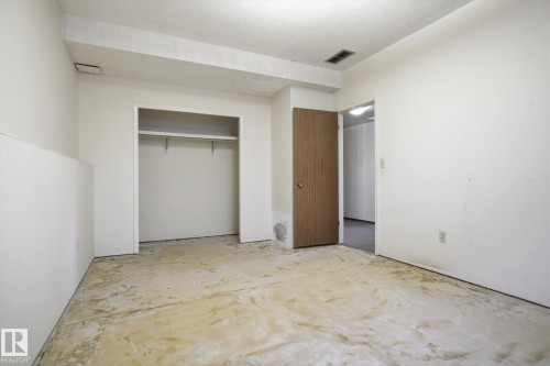 Unfurnished bedroom with a closet and unfinished concrete flooring - 17816 94 Street, Edmonton, AB - Indoor Photo Showing Other Room