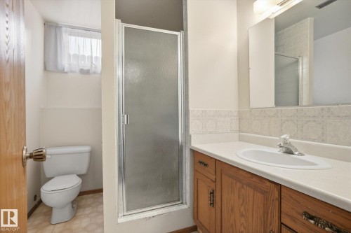 Full bath with vanity, a shower stall, and light floors - 17816 94 Street, Edmonton, AB - Indoor Photo Showing Bathroom