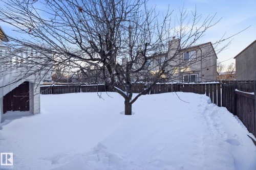 Snowy yard featuring a fenced backyard - 17816 94 Street, Edmonton, AB - Outdoor