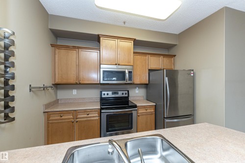 227 16807 100 Avenue, Edmonton, AB - Indoor Photo Showing Kitchen With Stainless Steel Kitchen With Double Sink