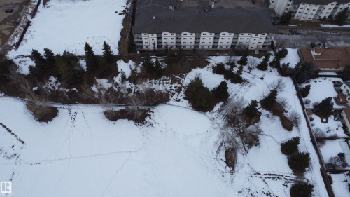 View of snowy aerial view - 227 16807 100 Avenue, Edmonton, AB - Outdoor With View