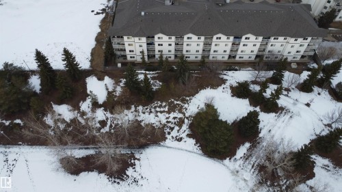 Snowy aerial view featuring a view of apartment building / complex - 227 16807 100 Avenue, Edmonton, AB - Outdoor