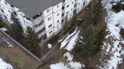 Snowy aerial view with a view of apartment building / complex - 