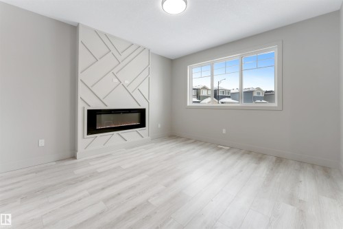 4371 37 Street, Beaumont, AB - Indoor Photo Showing Living Room With Fireplace