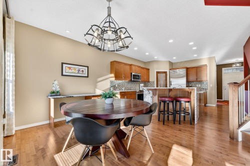 Dining space featuring suspended lighting and light wood-style flooring - 2036 Hilliard Place, Edmonton, AB - Indoor Photo Showing Dining Room