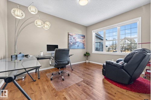 Office space featuring light wood-style flooring and a textured ceiling - 2036 Hilliard Place, Edmonton, AB - Indoor Photo Showing Office