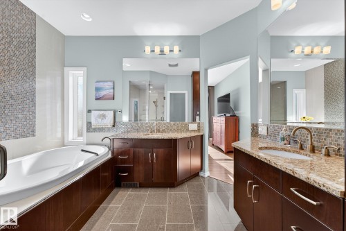 Bathroom with two vanities, a shower stall, decorative backsplash, a garden tub, and recessed lighting - 2036 Hilliard Place, Edmonton, AB - Indoor Photo Showing Bathroom