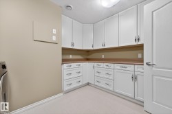 Laundry room with a textured ceiling and washer / clothes dryer - 